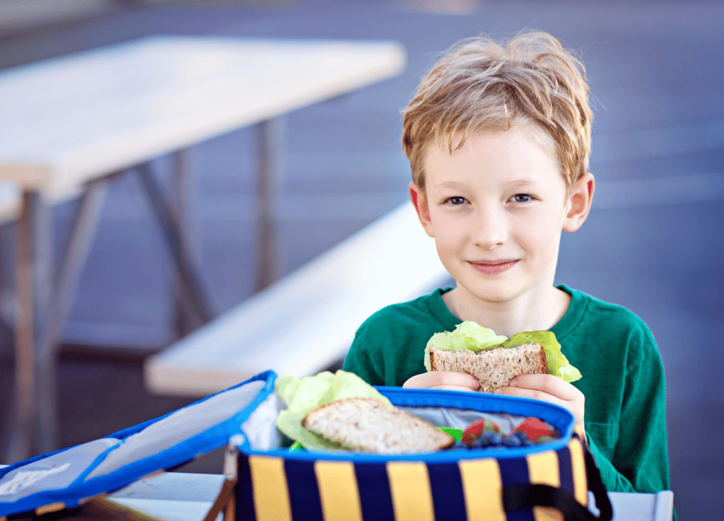 A child eating his school lunch