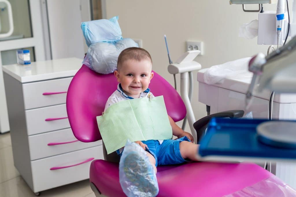 boy sitting in dentist chair childrens dentist calgary