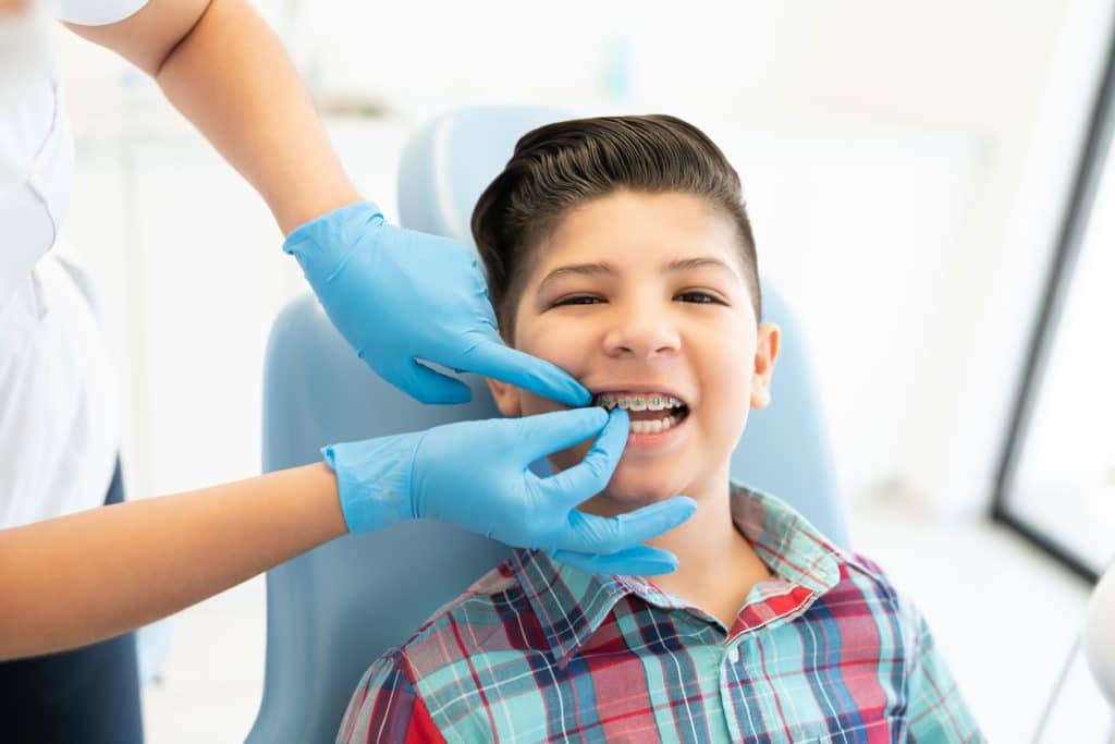 boy with braces best pediatric dentist calgary